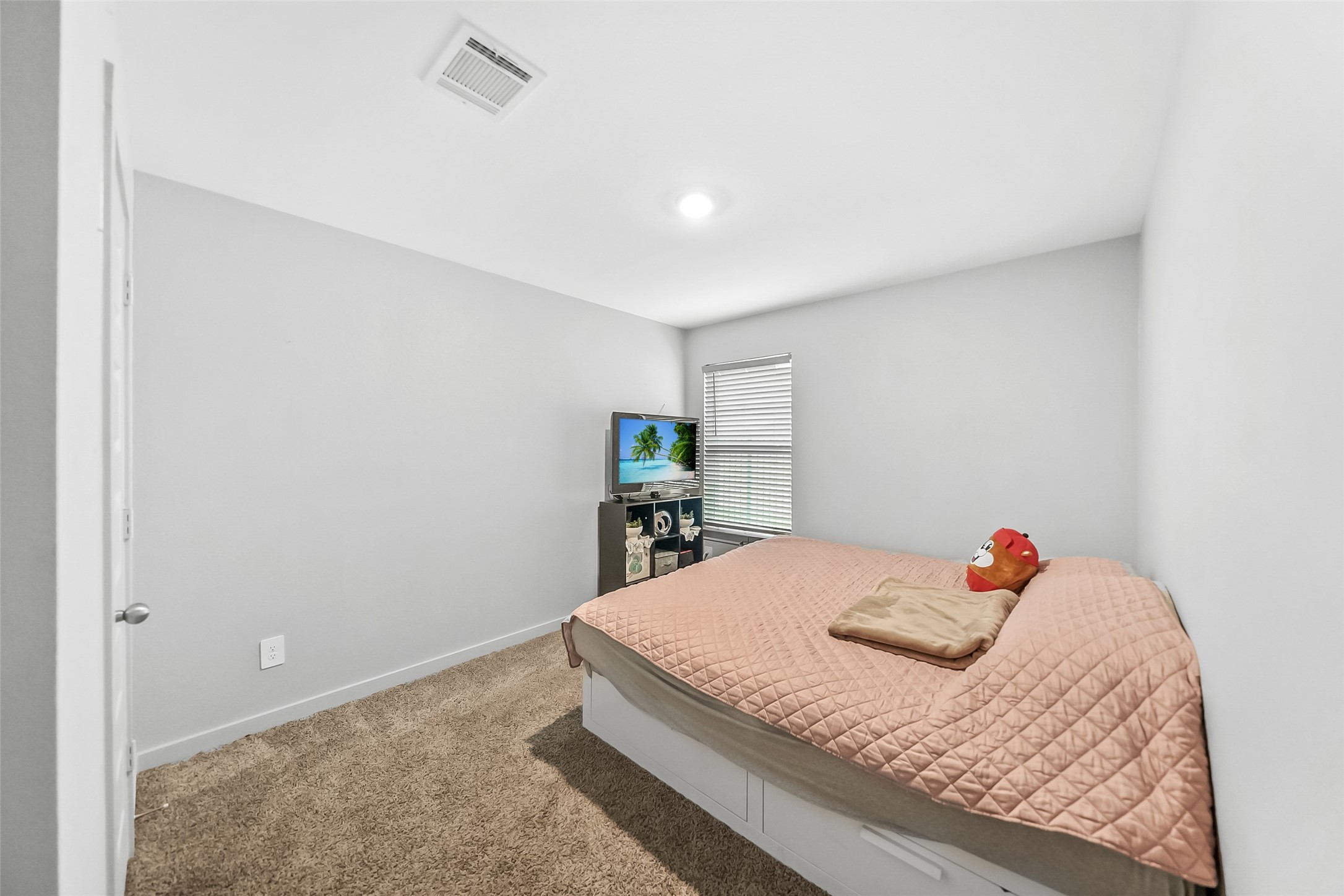1514 Truckee River Drive Rosharon, TX 77583 - Photo 6 of 23 a bedroom with a bed and a wooden floor
