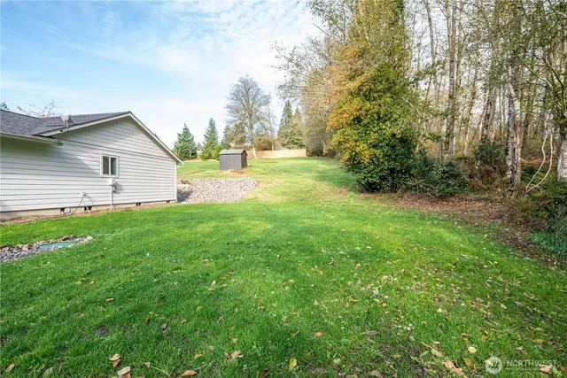 a view of a pathway with a yard