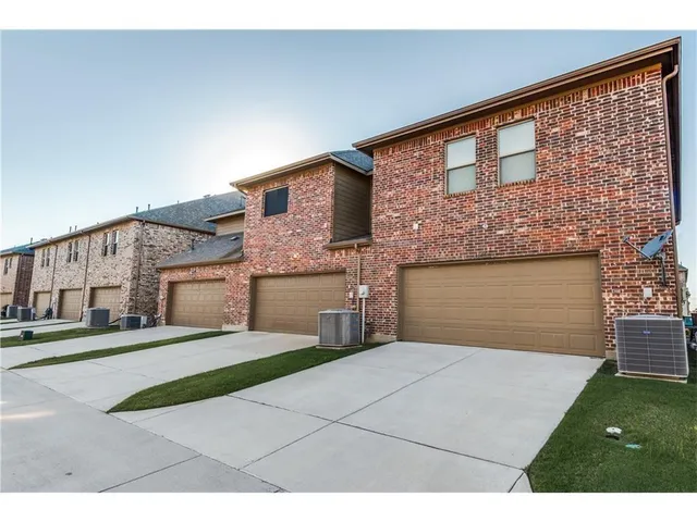 a front view of a house with yard