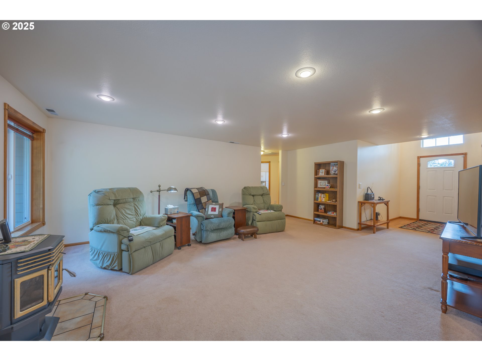 2184 13th Street Florence, OR 97439 - Photo 12 of 44 a living room with furniture and a flat screen tv