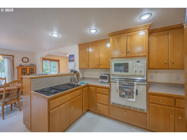 a kitchen with stainless steel appliances granite countertop a sink and cabinets
