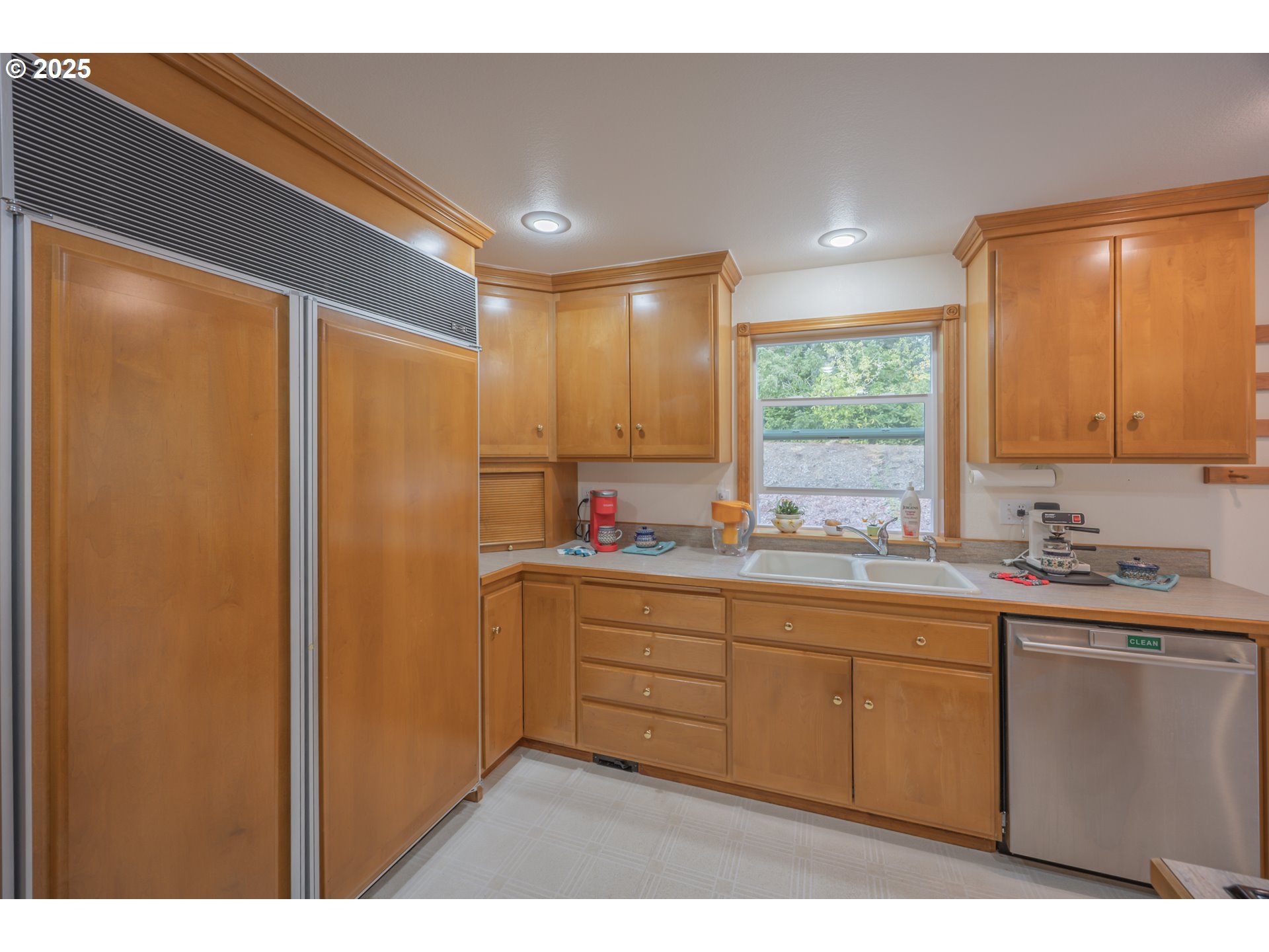 2184 13th Street Florence, OR 97439 - Photo 19 of 44 a kitchen with sink cabinets and window