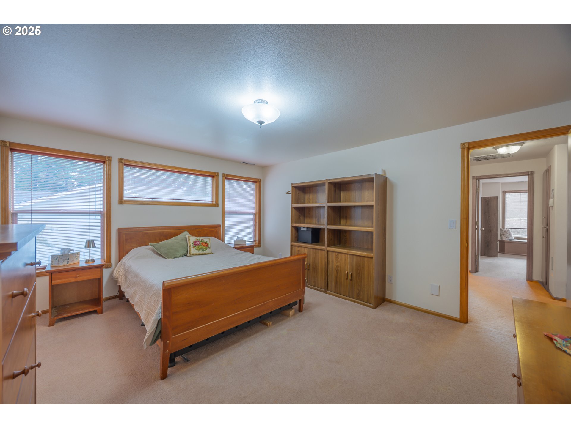2184 13th Street Florence, OR 97439 - Photo 23 of 44 a bedroom with a bed and a window