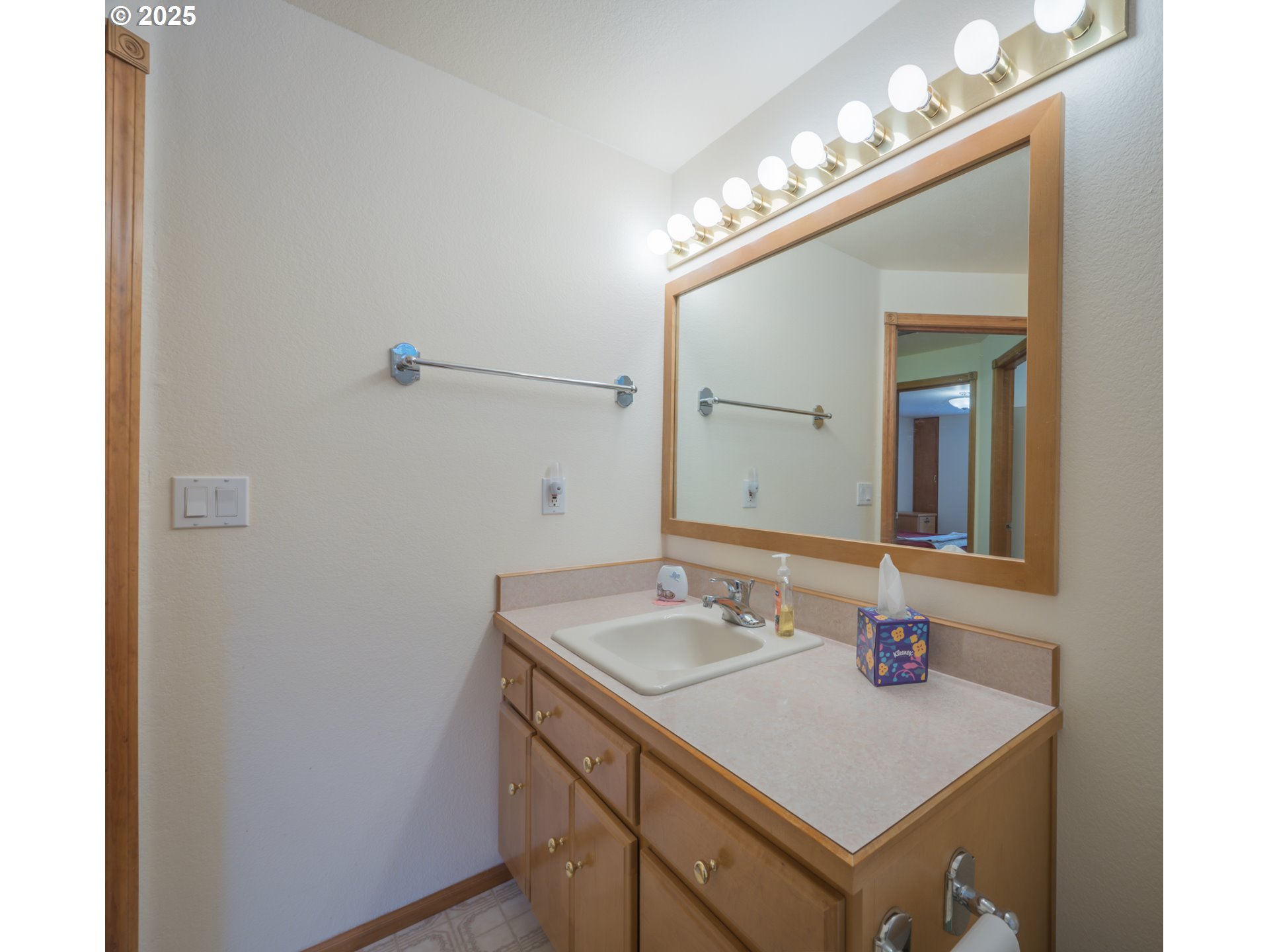 2184 13th Street Florence, OR 97439 - Photo 30 of 44 a bathroom with a sink and a mirror
