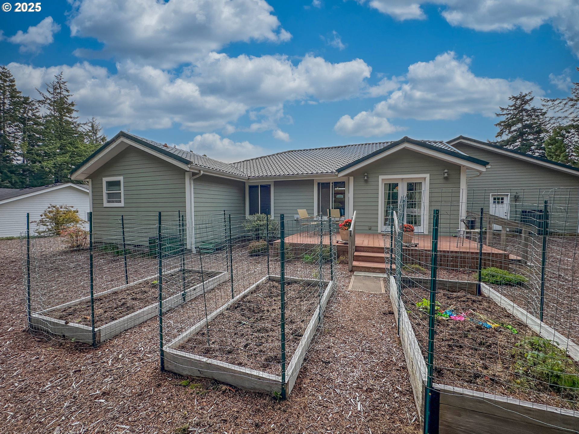 2184 13th Street Florence, OR 97439 - Photo 36 of 44 a view of a house with a yard balcony and couches