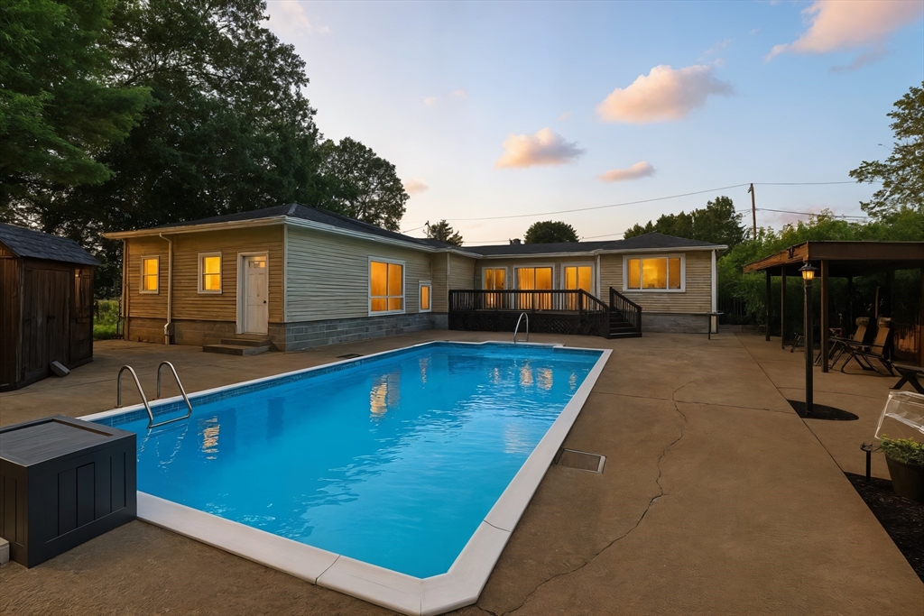 158 Chudy Street Three Rivers, MA 01080 - Photo 1 of 42 a view of swimming pool with outdoor seating