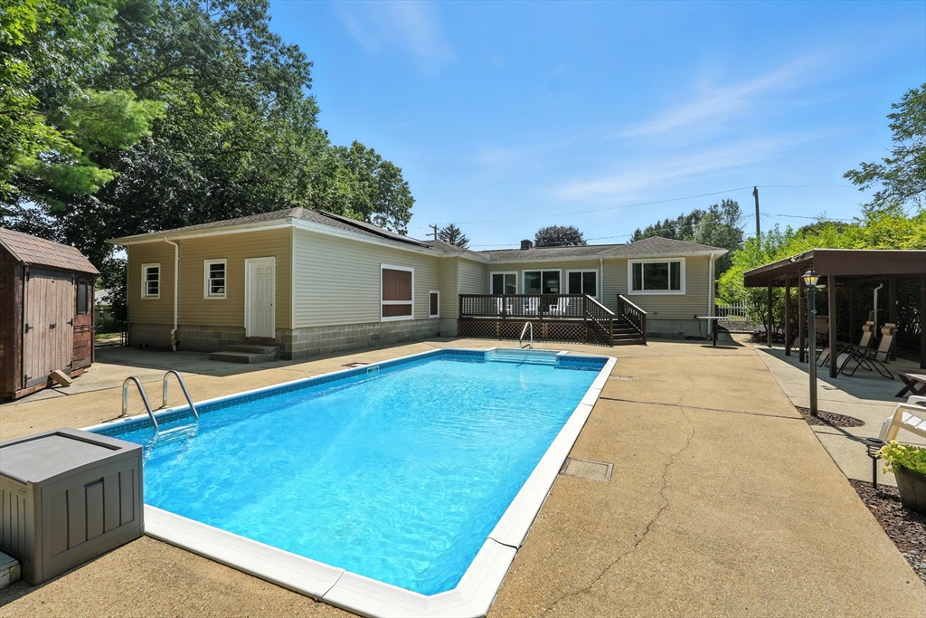158 Chudy Street Three Rivers, MA 01080 - Photo 16 of 42 a view of a house with pool and chairs