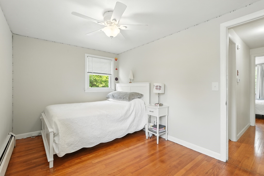 158 Chudy Street Three Rivers, MA 01080 - Photo 29 of 42 a bed room with a bed and a chandelier