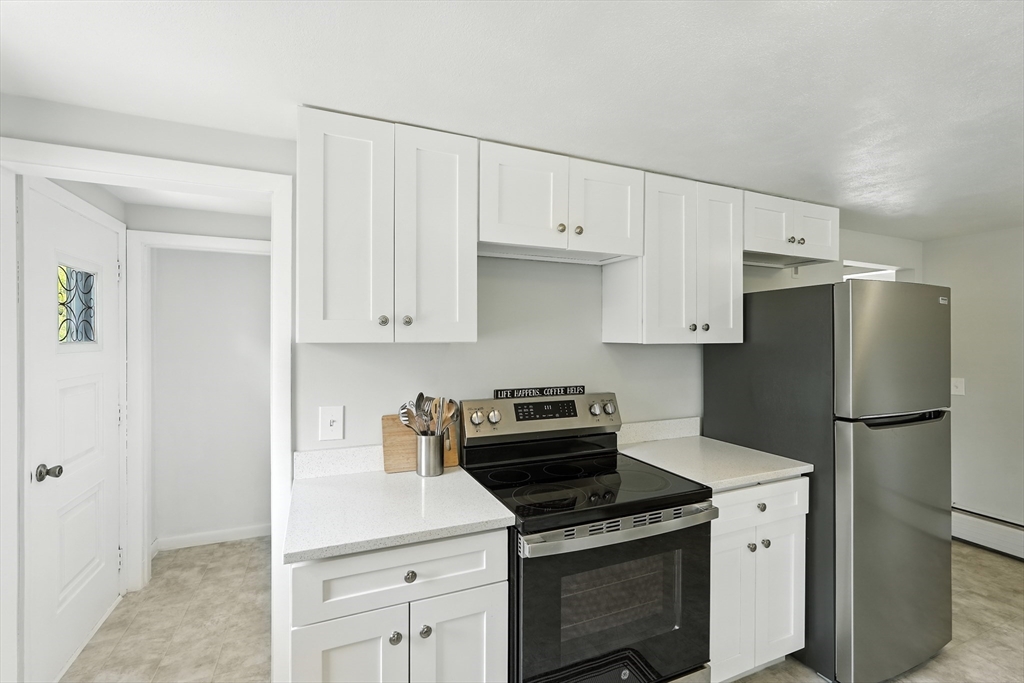 158 Chudy Street Three Rivers, MA 01080 - Photo 3 of 42 a kitchen with a stove sink and refrigerator