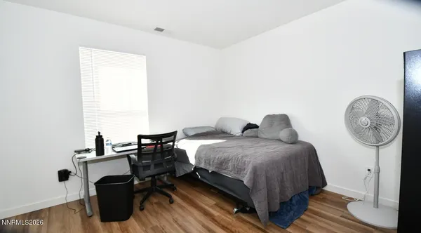 a bedroom with bed and a closet