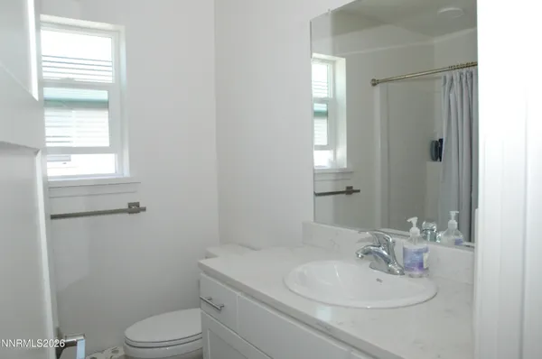 a bathroom with a sink toilet and vanity
