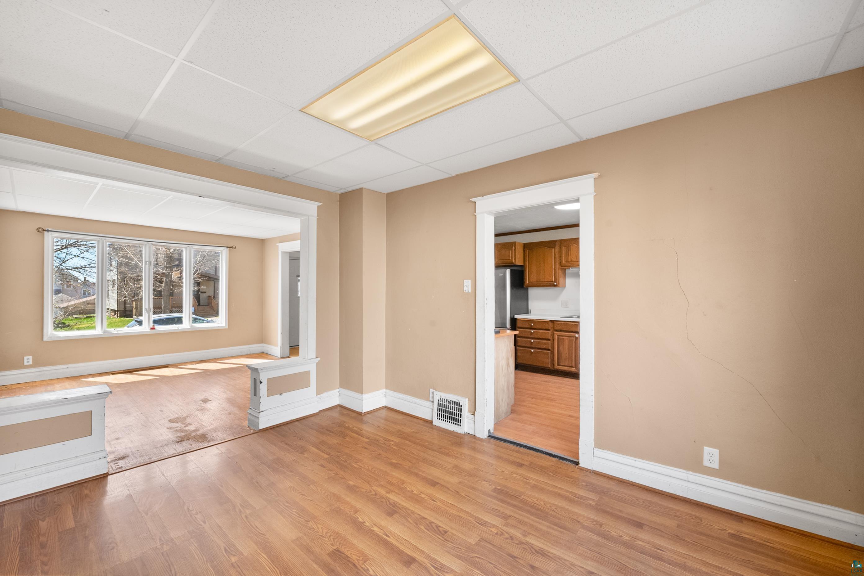 3067 Restormel Street Duluth, MN 55806 - Photo 6 of 25 Spacious interior featuring wood-finish flooring, neutral-toned walls, and white trim