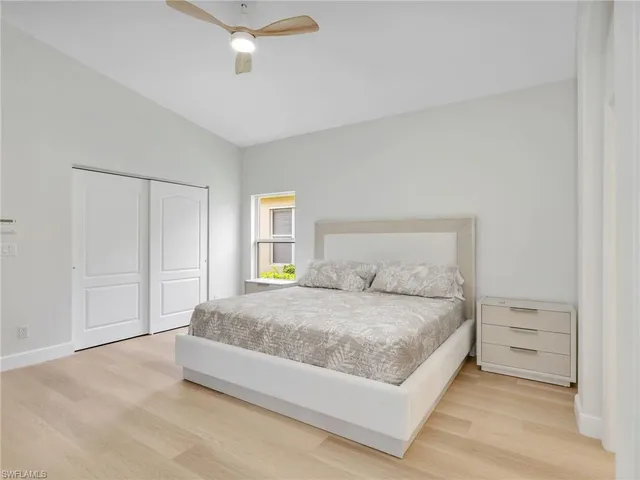 a bedroom with a bed and window