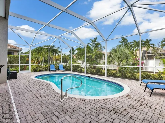 a view of a swimming pool with a patio