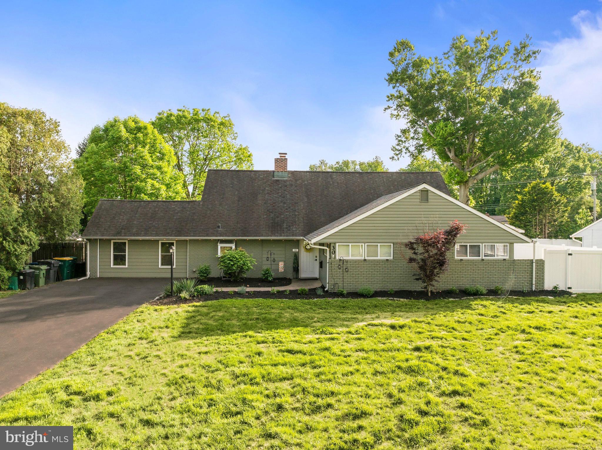 30 Roving Road Levittown, PA 19056 - Photo 1 of 40 a front view of house with yard and trees around