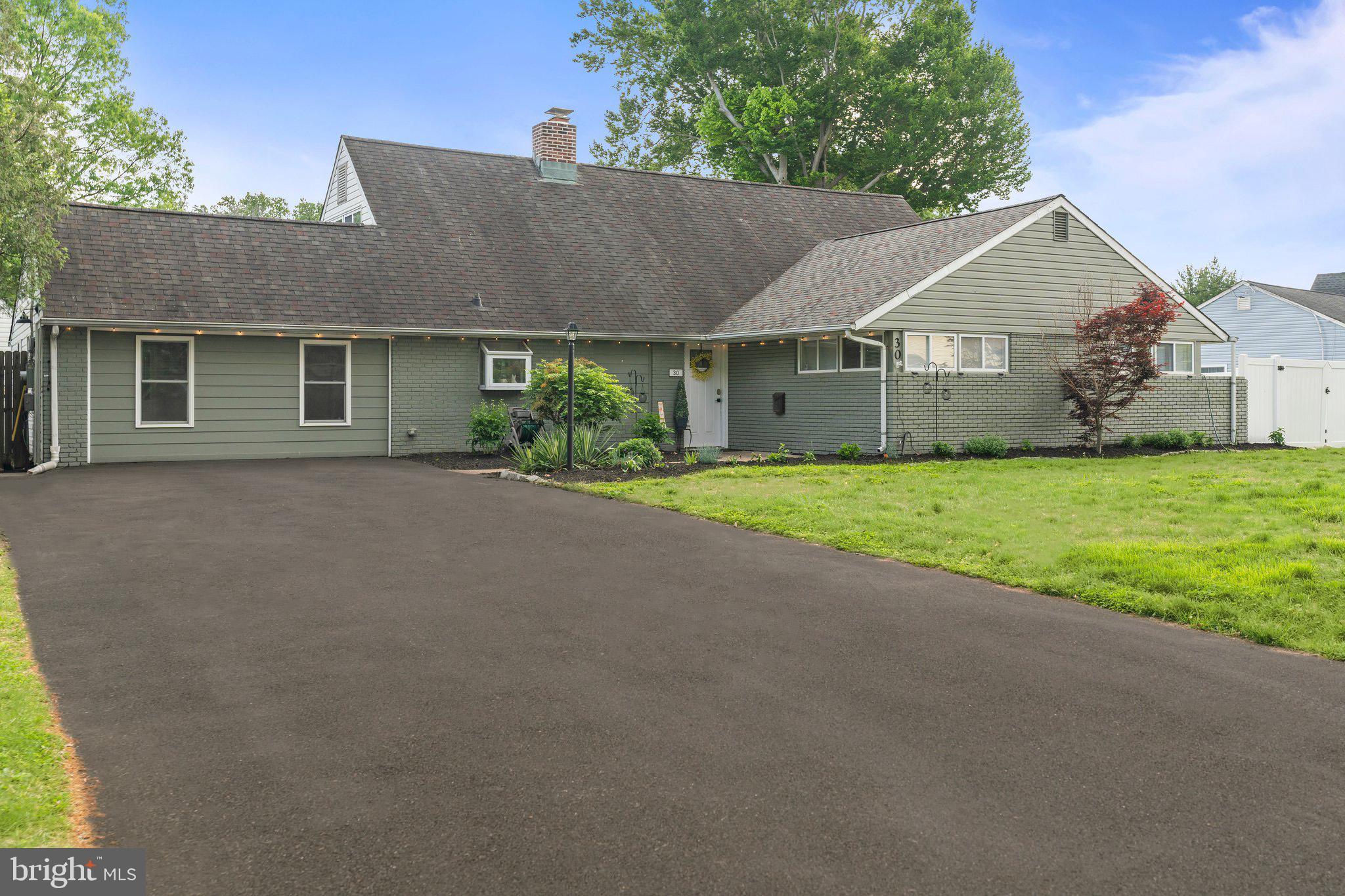 30 Roving Road Levittown, PA 19056 - Photo 2 of 40 a view of a house with a yard and large tree
