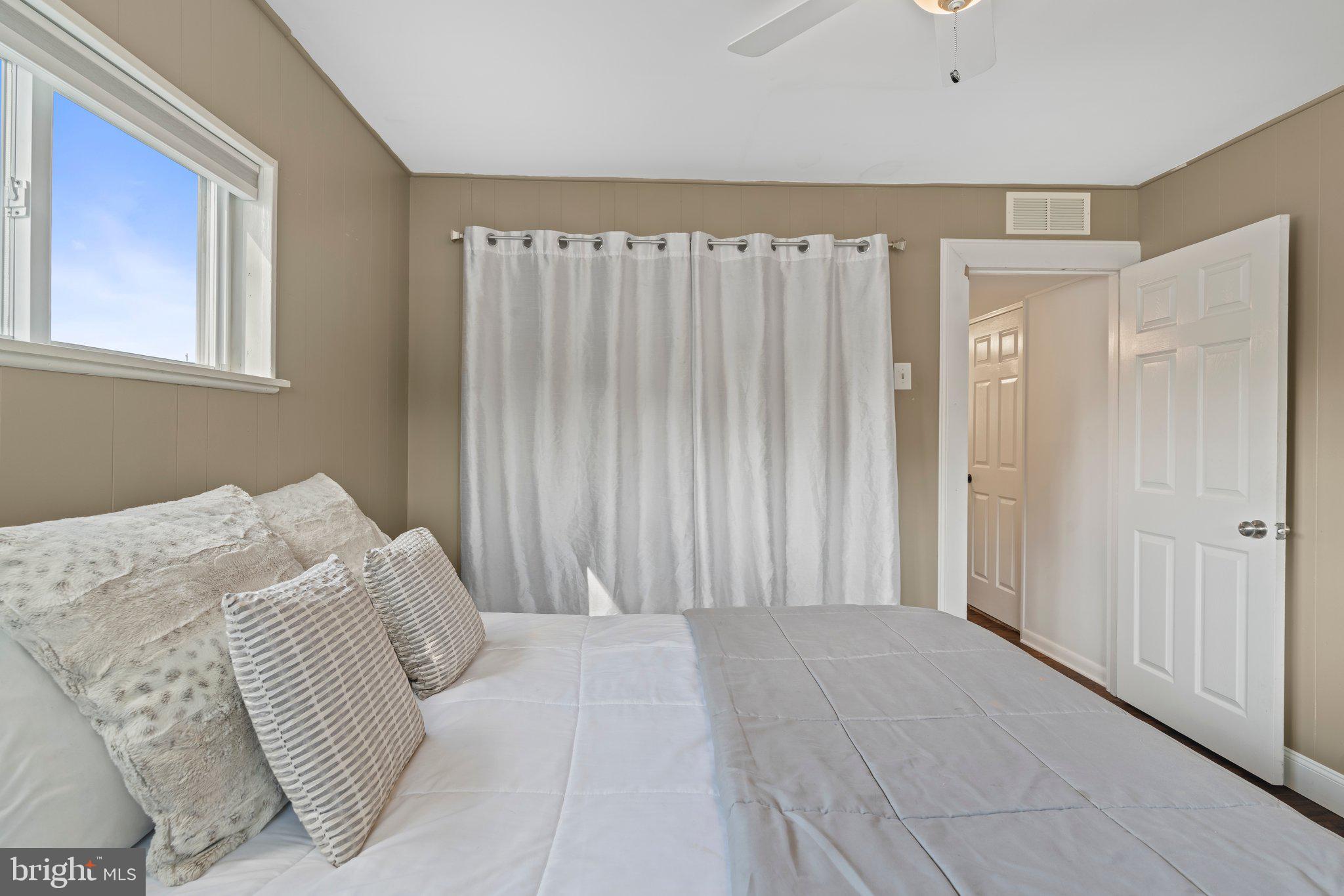 30 Roving Road Levittown, PA 19056 - Photo 24 of 40 a bedroom with a bed and a window