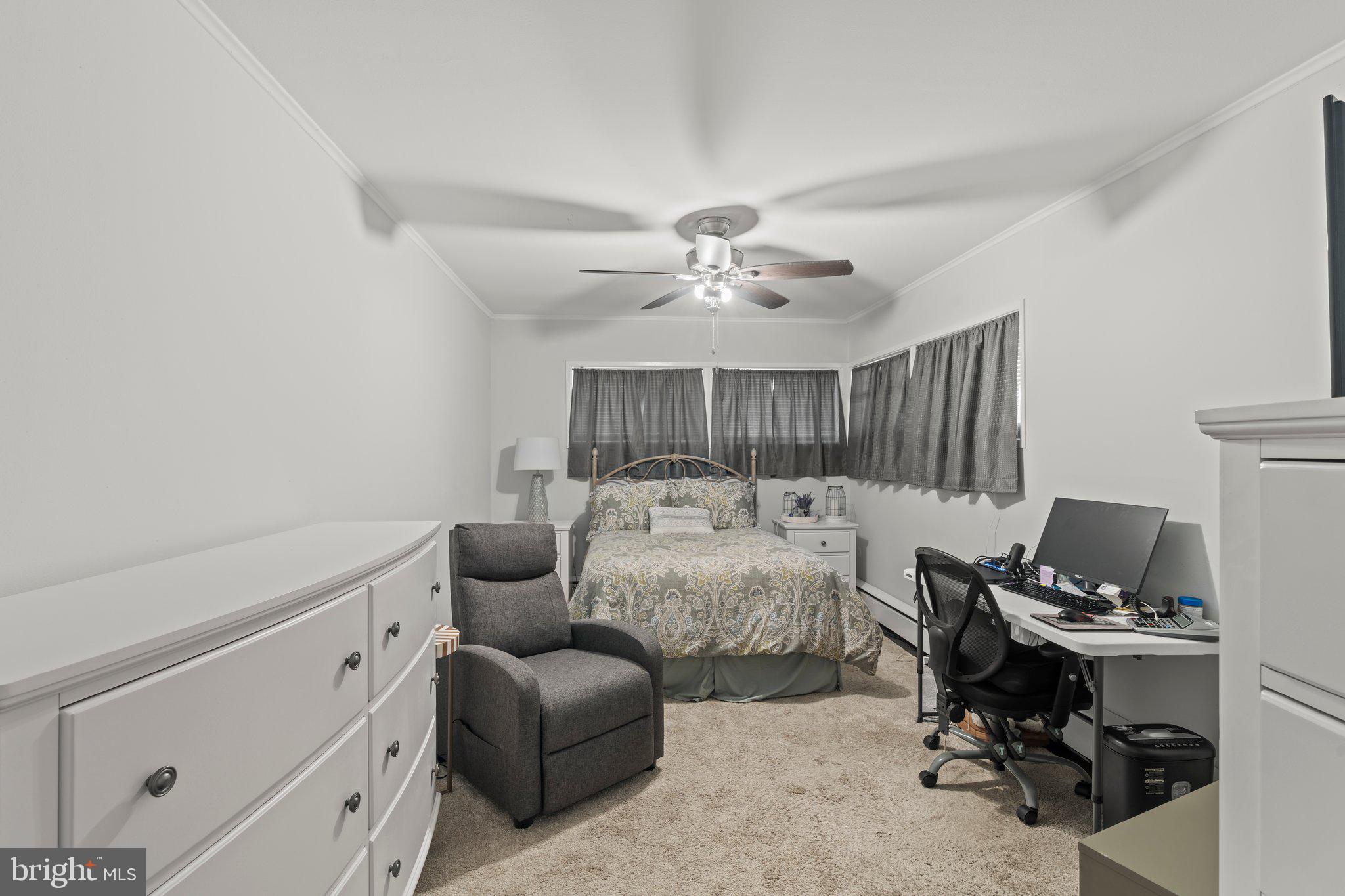 30 Roving Road Levittown, PA 19056 - Photo 27 of 40 a bed room with furniture and a chandelier