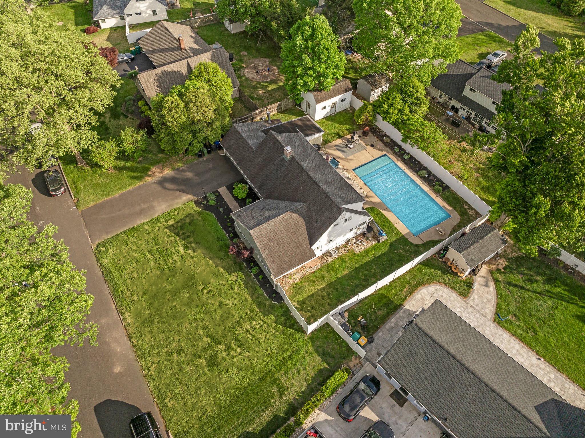 30 Roving Road Levittown, PA 19056 - Photo 3 of 40 an aerial view of a tennis ground with a large tree