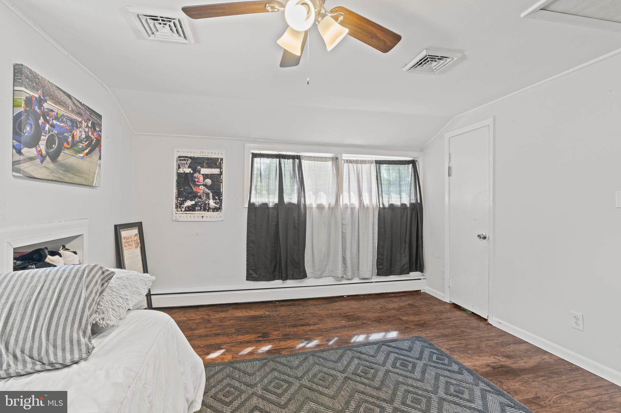30 Roving Road Levittown, PA 19056 - Photo 35 of 40 a bedroom with a bed and a painting on the wall