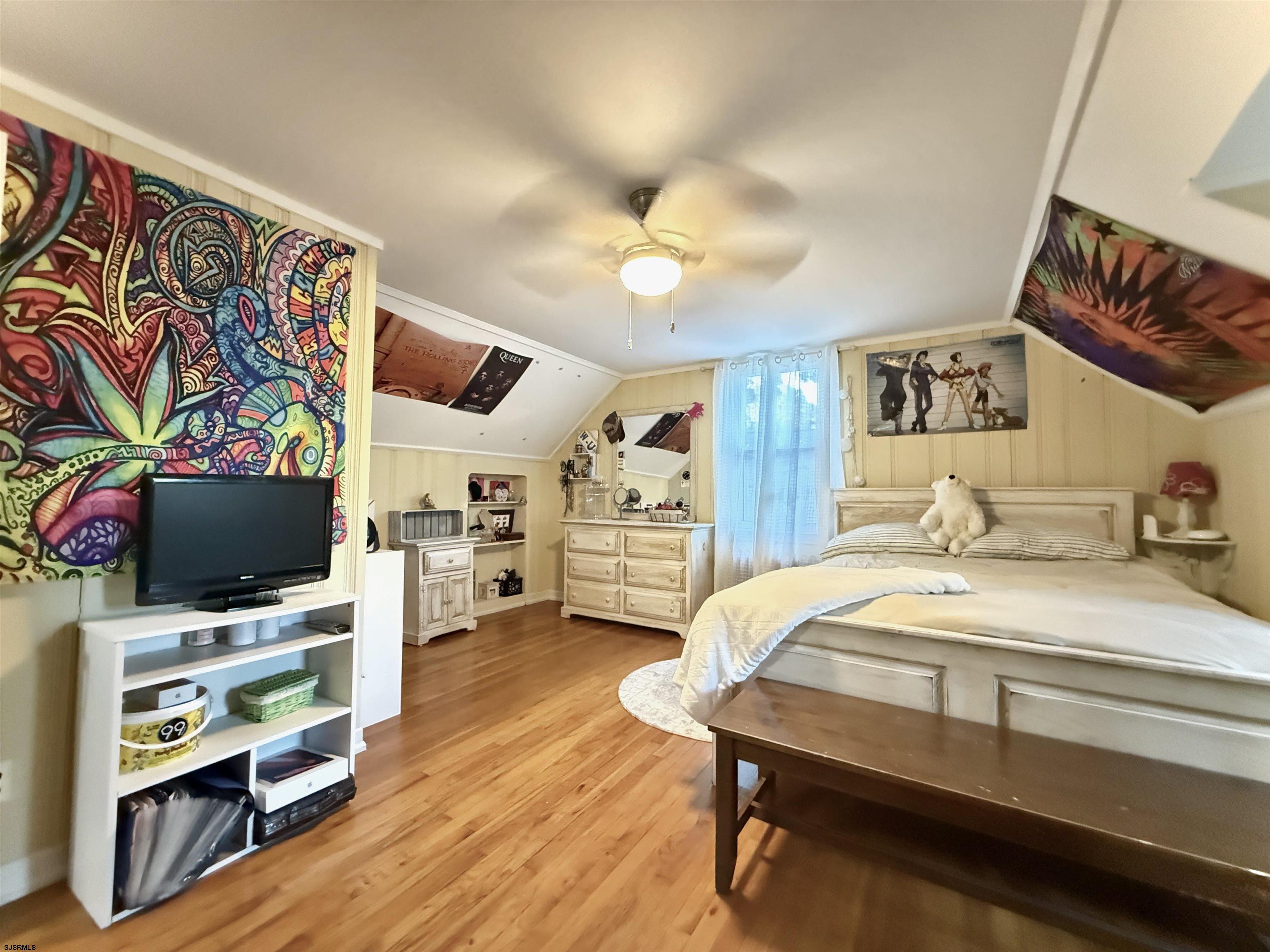 605 Shore Road Linwood, NJ 08221 - Photo 81 of 99 a bedroom with furniture and a flat screen tv