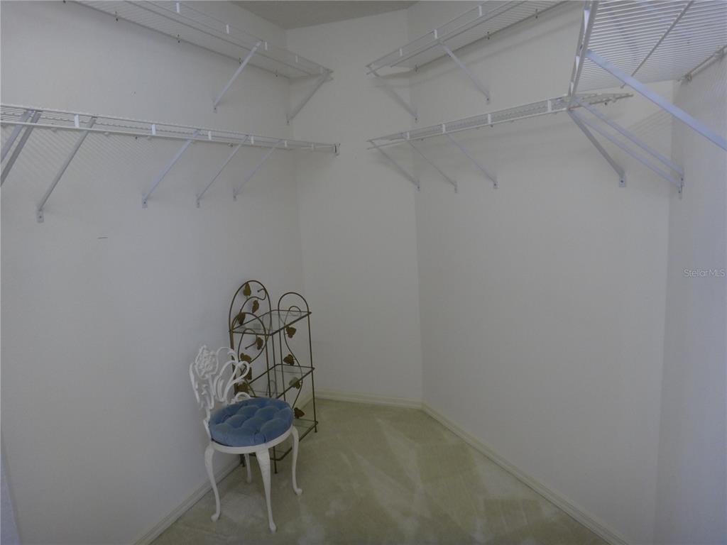 Undisclosed Address Sarasota, FL 34238 - Photo 12 of 26 a room with water heater and wooden cabinets