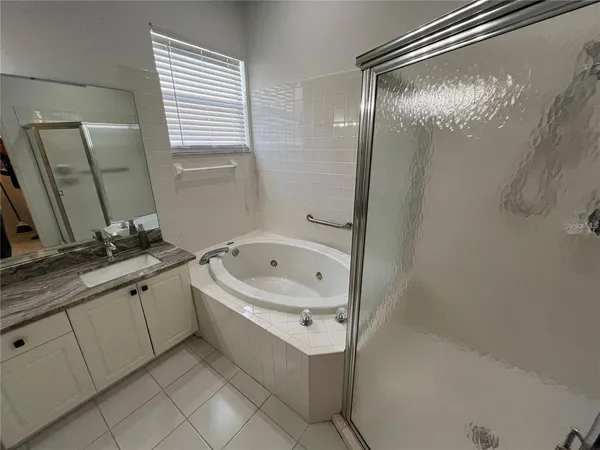 a bathroom with a bathtub and a sink