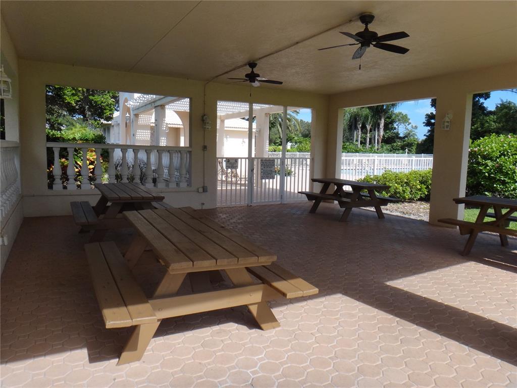 Undisclosed Address Sarasota, FL 34238 - Photo 26 of 26 a living room with patio furniture and windows