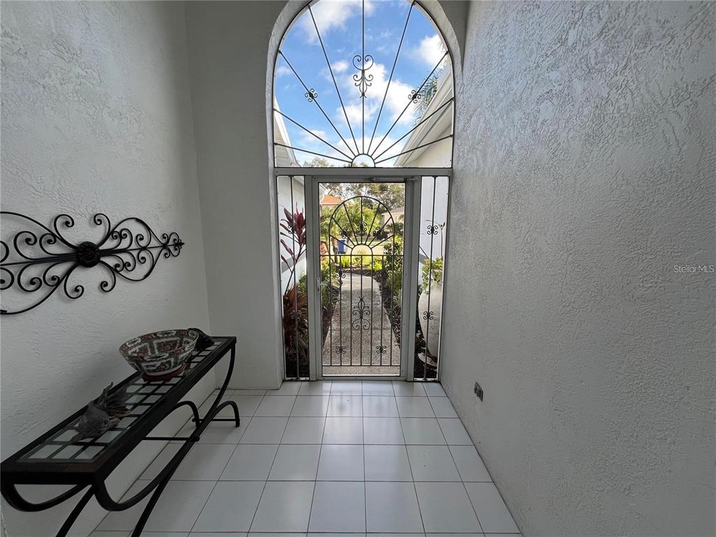 Undisclosed Address Sarasota, FL 34238 - Photo 4 of 26 a view of entryway with a window