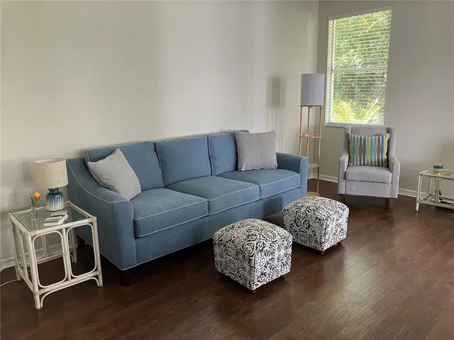 a living room with furniture and a window