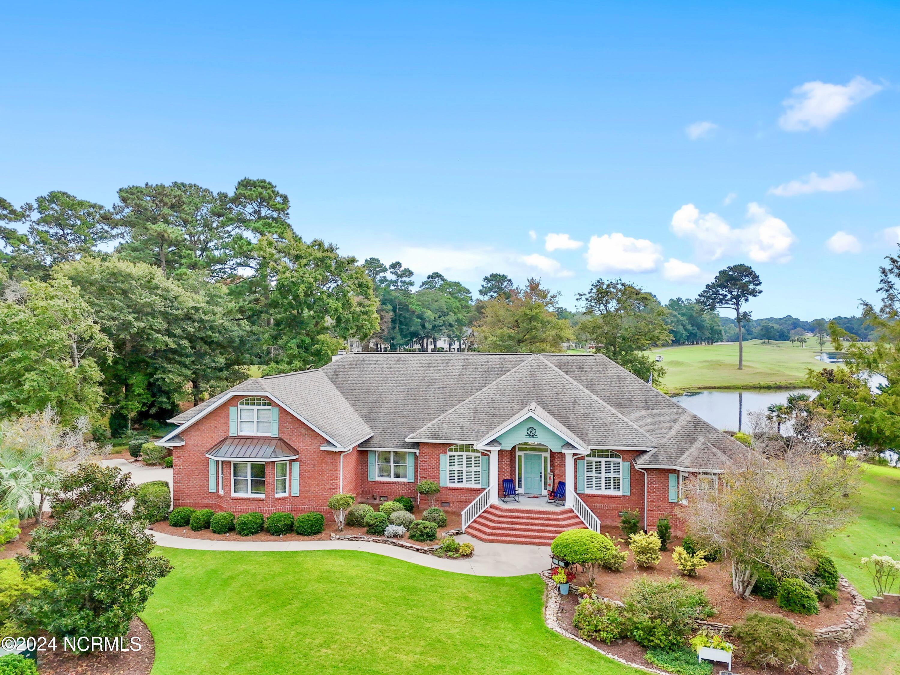 181 Rice Mill Circle Sunset Beach, NC 28468 - Photo 1 of 87 Front of home