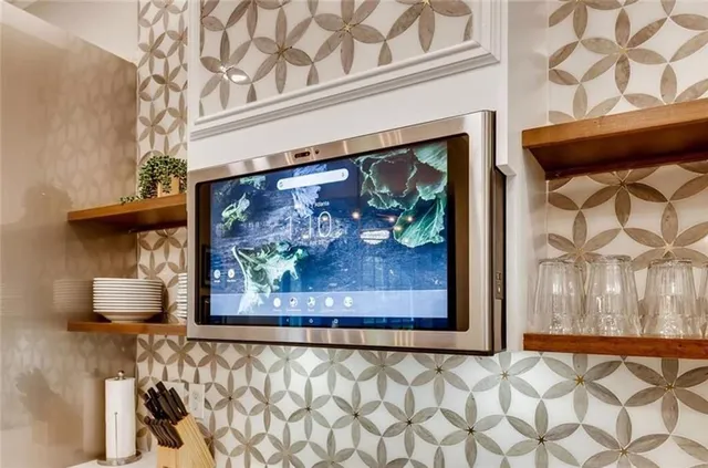 a painting on a wall next to a window