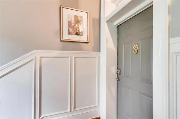 a view of a hallway with front door