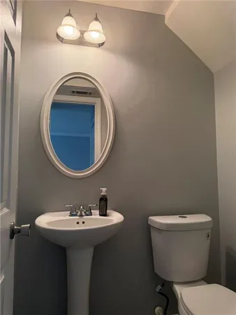 a bathroom with a sink and mirror