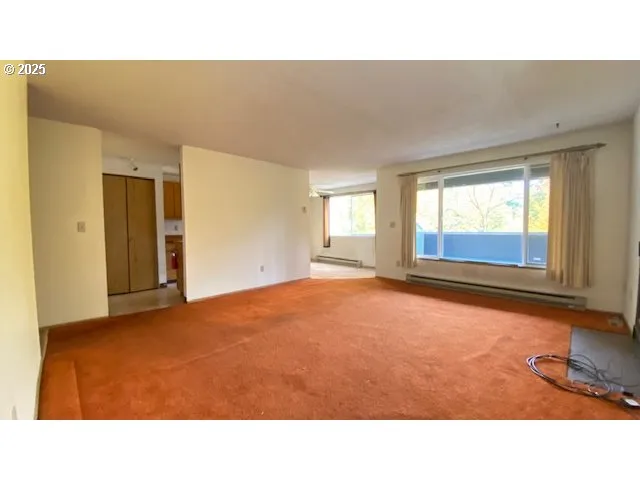 a room with a bed and window