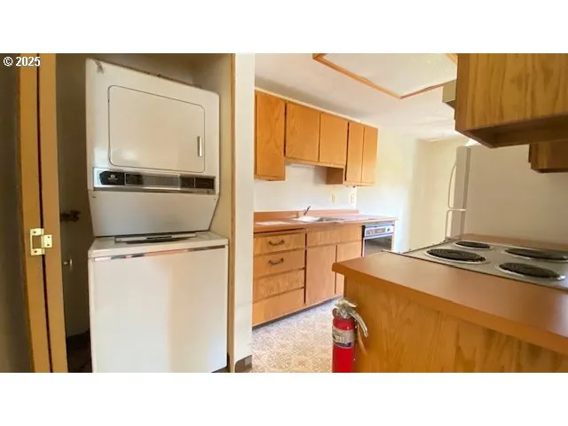 a kitchen with appliances cabinets and a sink