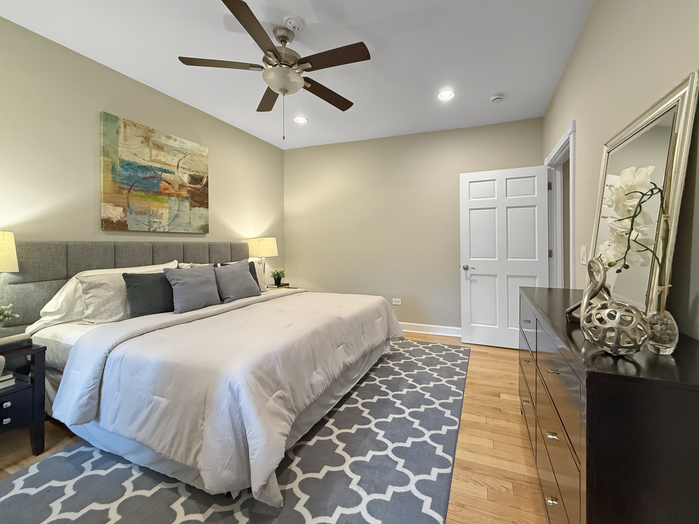1325 West Addison Street, Unit 1A Chicago, IL 60613 - Photo 9 of 15 a bedroom with double bed and a chandelier