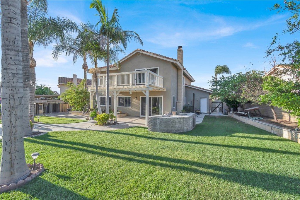 3350 May Court Riverside, CA 92503 - Photo 46 of 55 a front view of a house with garden and trees