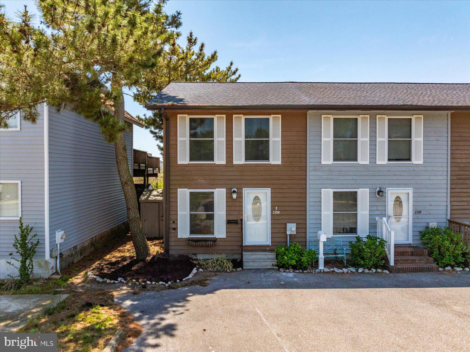 135 Jamestown Road, Unit 18A Ocean City, MD 21842 - Photo 9 of 63 a front view of a house with a yard