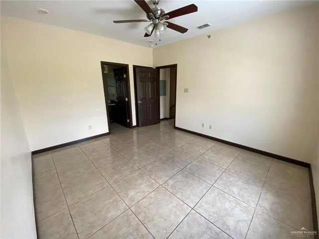 a view of an empty room with closet