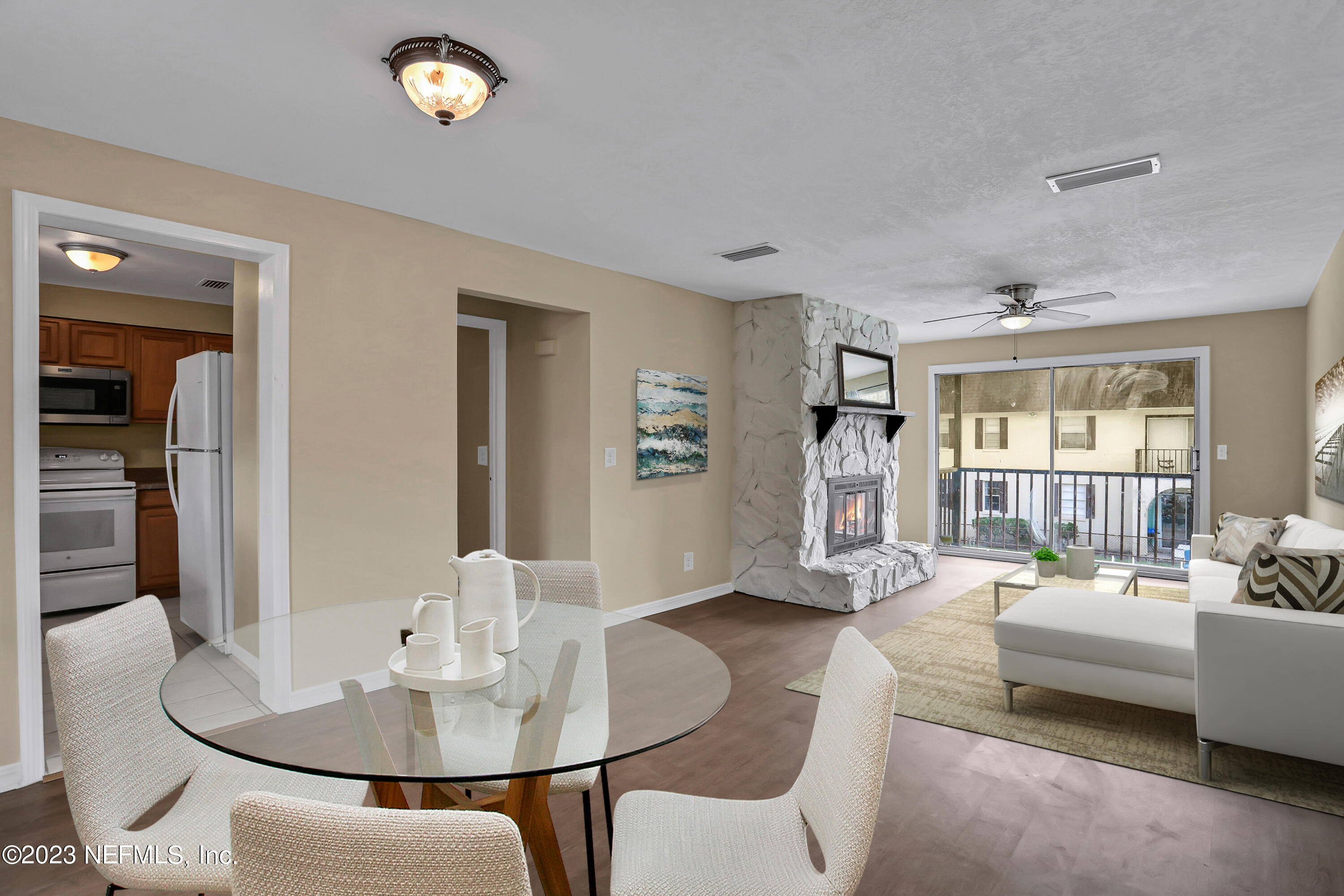 1735 El Camino Road, Unit 5 Jacksonville, FL 32216 - Photo 2 of 32 a living room with furniture and a table