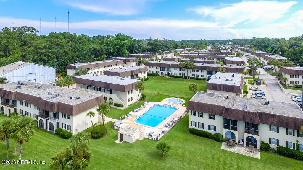 1735 El Camino Road, Unit 5 Jacksonville, FL 32216 - Photo 22 of 32 an aerial view of a house with a garden
