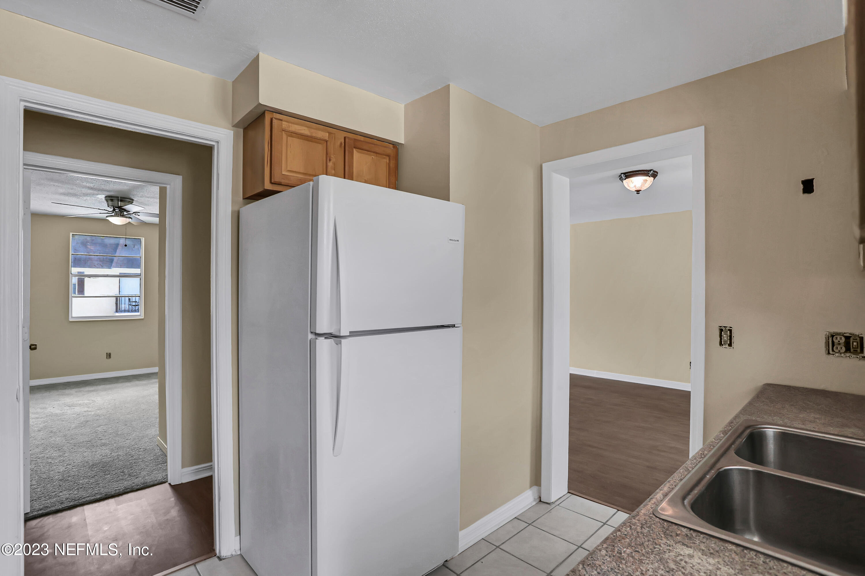 1735 El Camino Road, Unit 5 Jacksonville, FL 32216 - Photo 28 of 32 a white refrigerator freezer and a stove sitting inside of a kitchen
