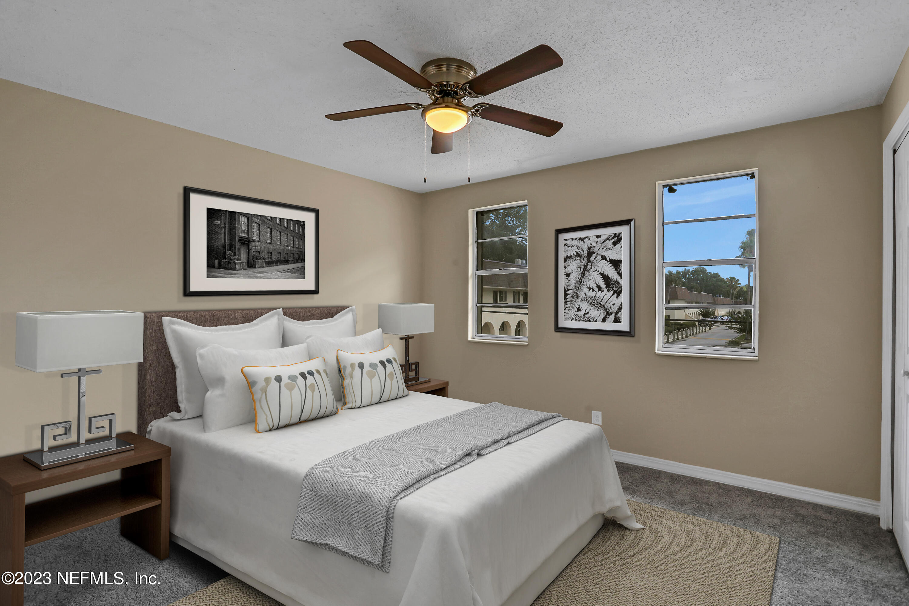 1735 El Camino Road, Unit 5 Jacksonville, FL 32216 - Photo 5 of 32 a bedroom with bed and painting on the wall