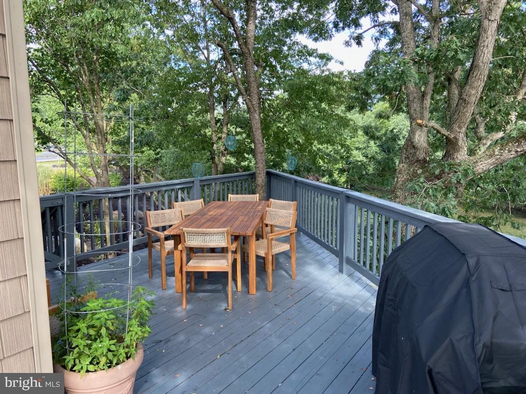 271 Ogden Farm Road Moorefield, WV 26836 - Photo 12 of 50 a balcony with wooden floor table and chairs