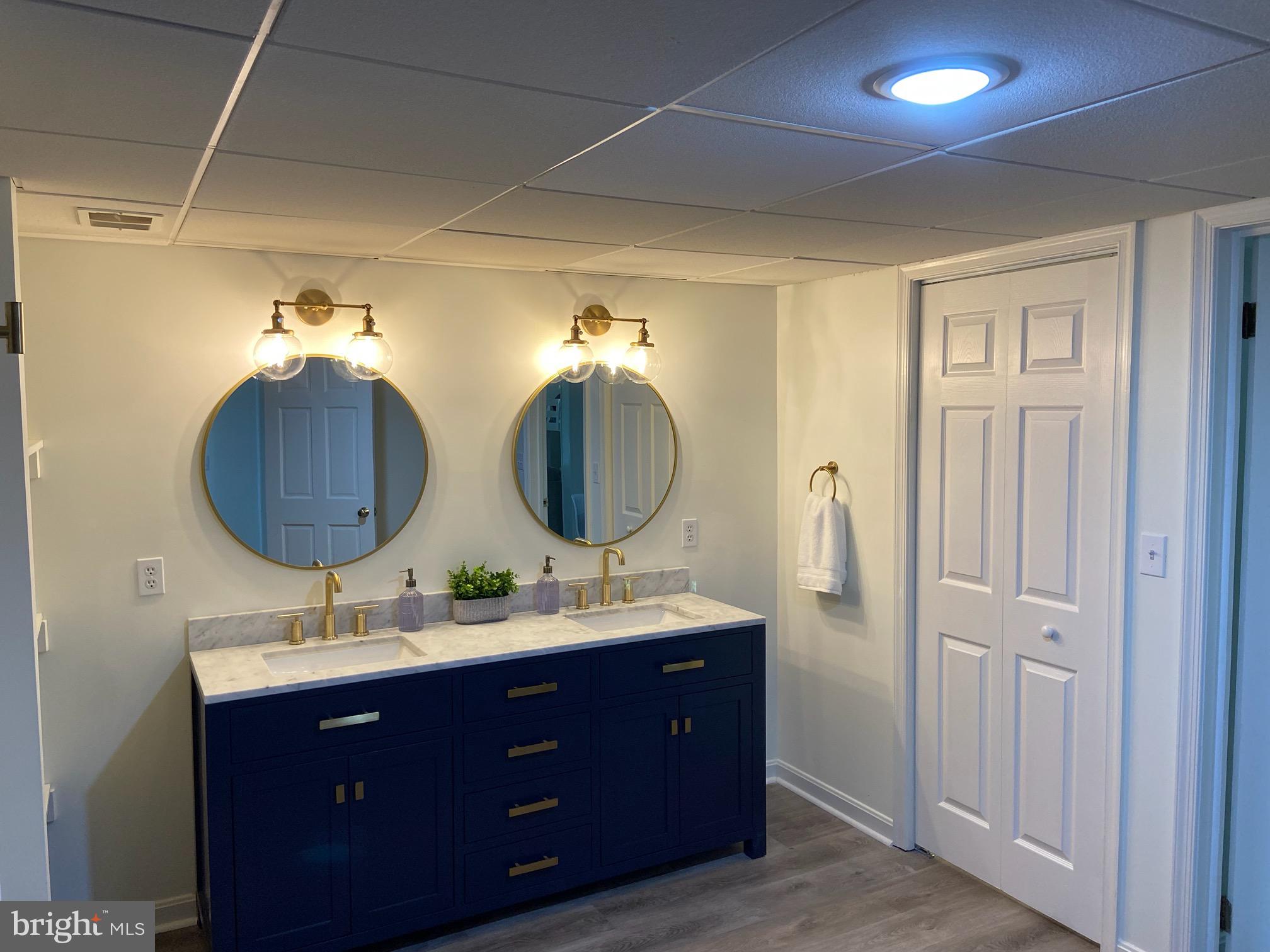 271 Ogden Farm Road Moorefield, WV 26836 - Photo 25 of 50 a bathroom with a double vanity sink and a mirror