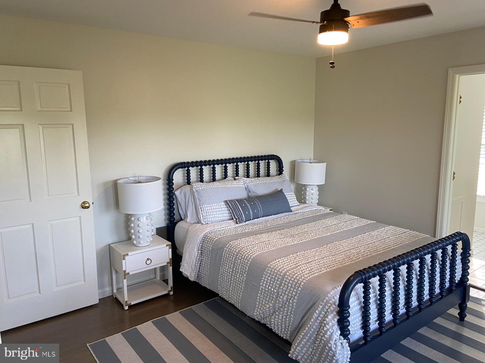 271 Ogden Farm Road Moorefield, WV 26836 - Photo 37 of 50 a bedroom with a bed and wooden floor