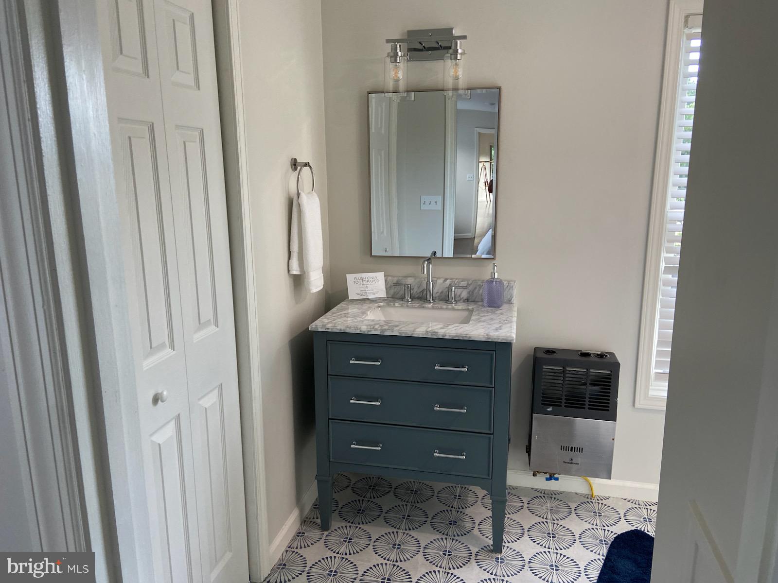 271 Ogden Farm Road Moorefield, WV 26836 - Photo 43 of 50 a bathroom with a granite countertop sink and a mirror