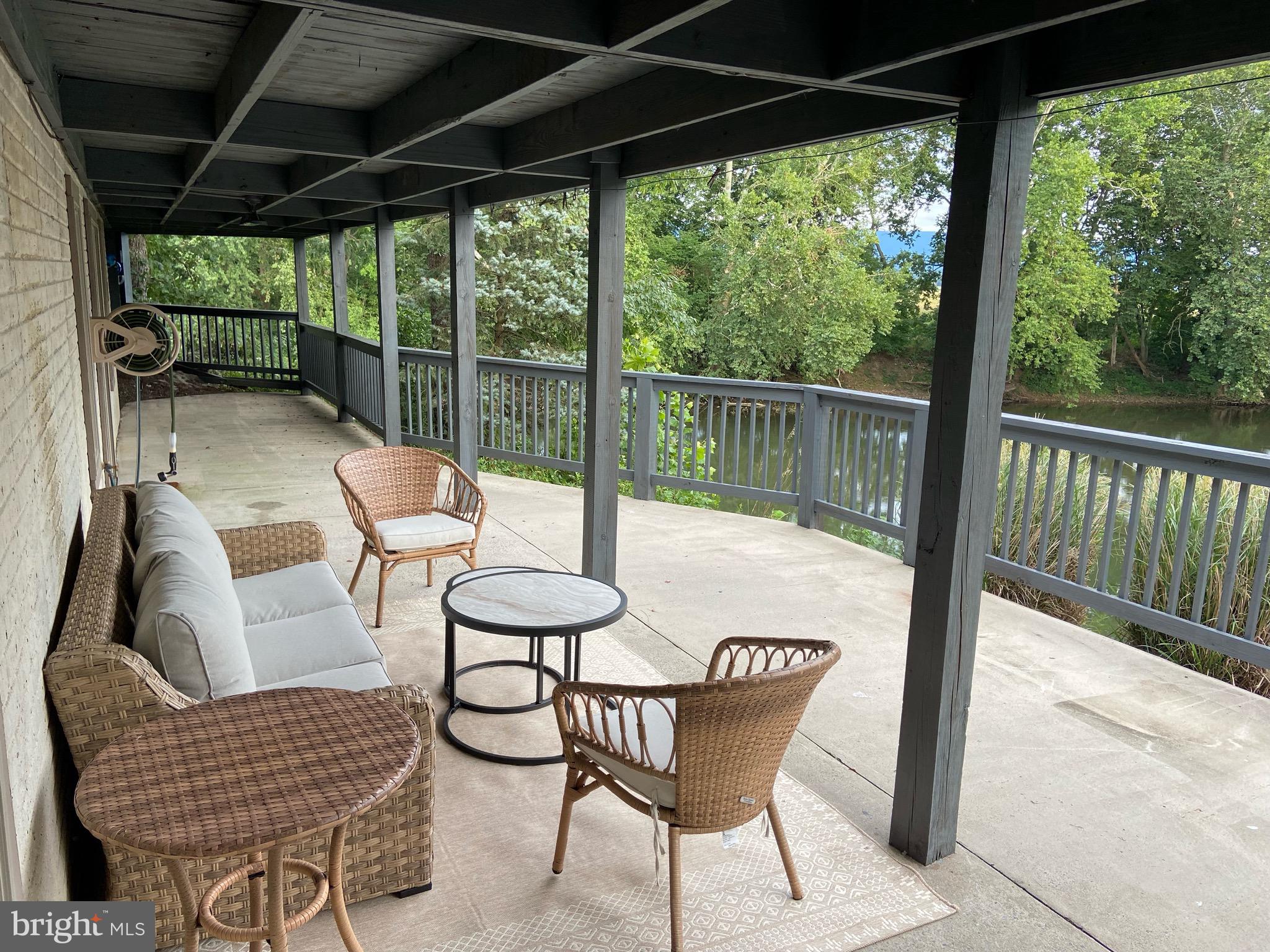 271 Ogden Farm Road Moorefield, WV 26836 - Photo 47 of 50 a view of porch with furniture and a yard