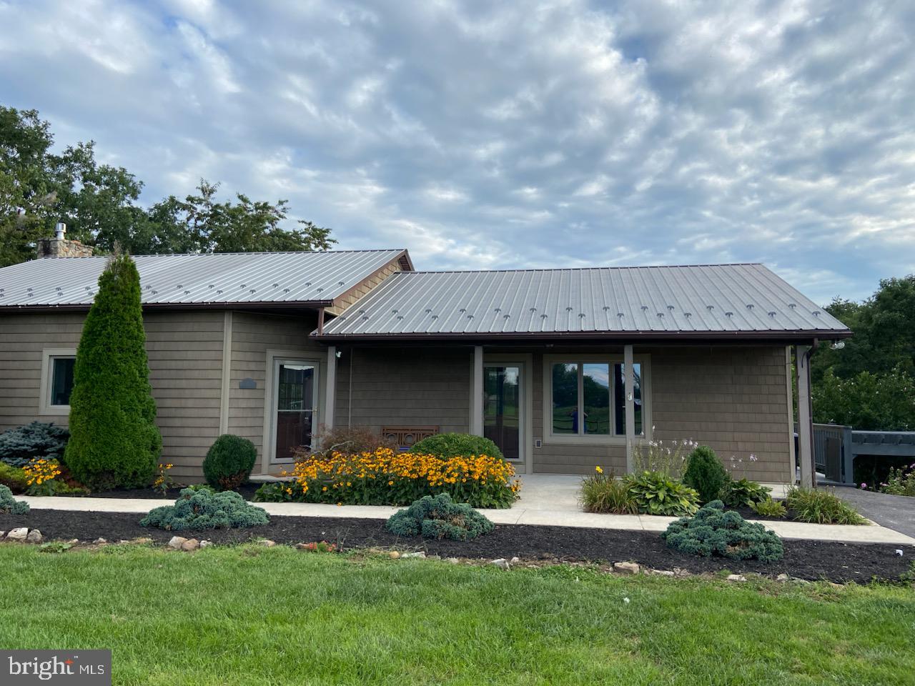 271 Ogden Farm Road Moorefield, WV 26836 - Photo 8 of 50 a front view of a house with a yard and garage